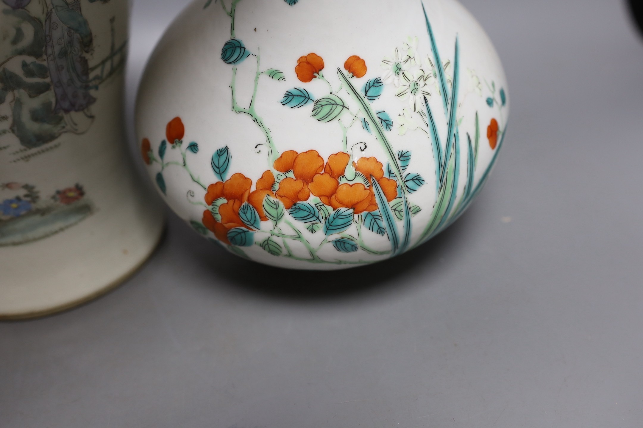 A Chinese enamelled porcelain bottle vase, 25cm high, together with a Chinese porcelain baluster jar, early 20th century, painted with figures and script